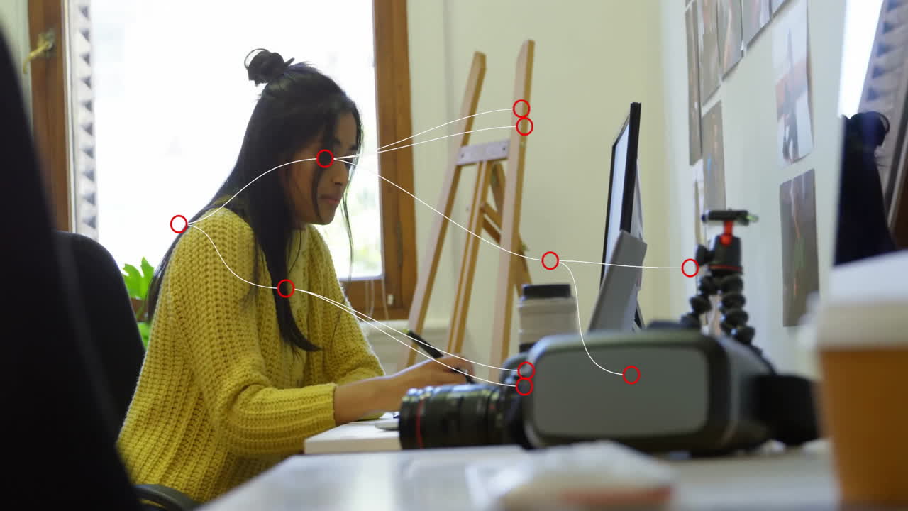 At school, woman in yellow sweater working with animation of digital connections