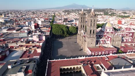 Drone-footage-showing-the-international-women's-day-march-in-the-streets-of-Puebla-city-in-Mexico