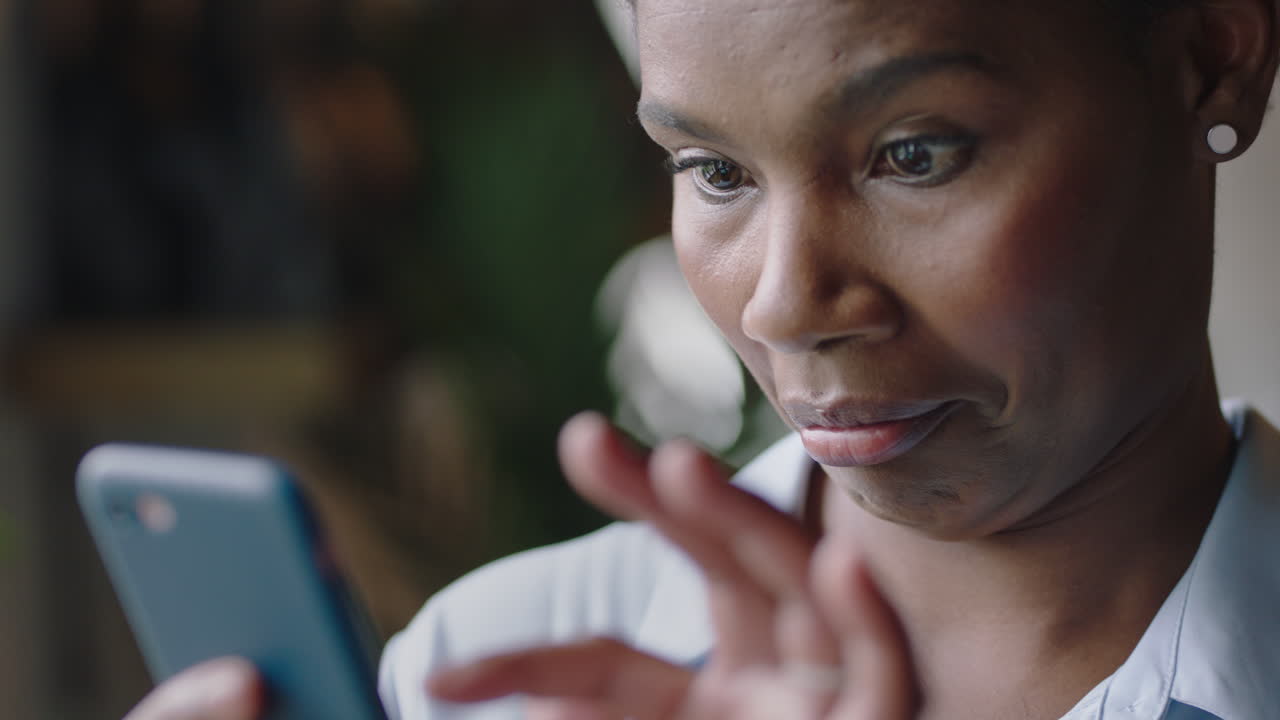 close up portrait funny business woman using smartphone browsing online making faces reading silly messages on social media texting enjoying mobile communication in cafe