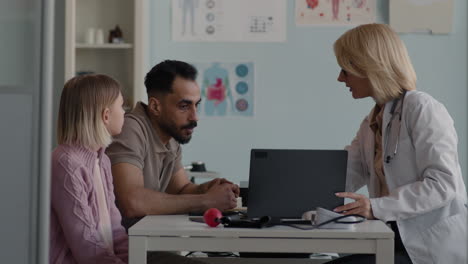 doctor consulting with patient and family