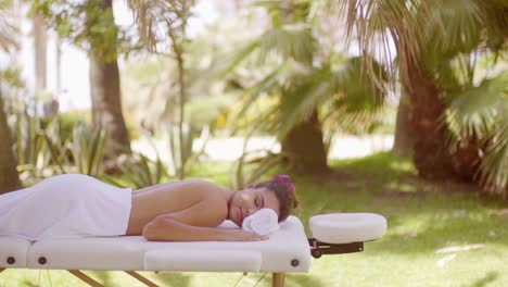 young woman at an outdoor spa at a tropical resort