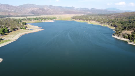 Vast-lake-Hemet-and-beautiful-mountain-range-in-horizon,-aerial-view