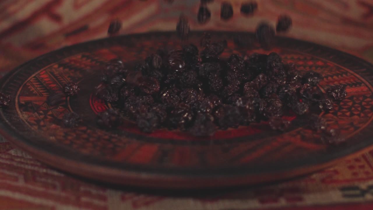 Dried raisins are thrown into a beautifully decorated serving dish