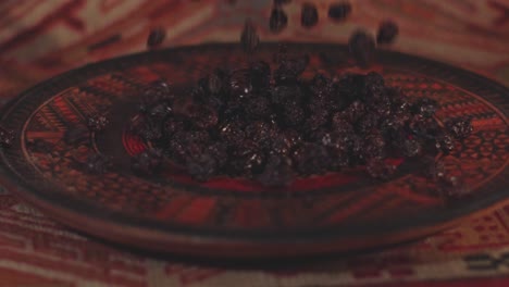 dried raisins are thrown into a beautifully decorated serving dish