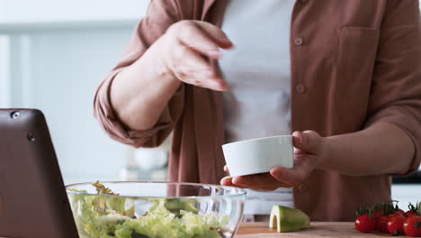 woman preparing a salad