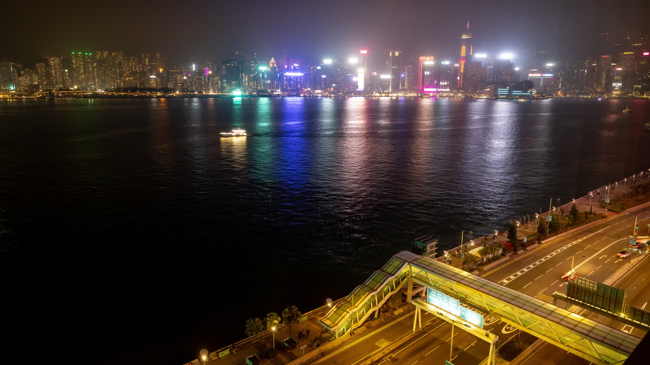 HONG KONG - 19 MARCH 2025 : Timelapse at Night of traffic on a highway in Kowloon, Hong Kong