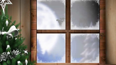 animation von weihnachtsmann im schlitten mit rentieren, die durch fenster und weihnachtsbaum gesehen werden