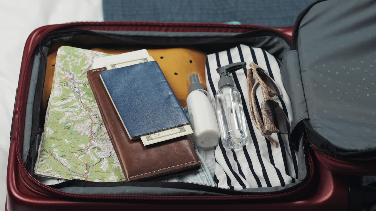 Essentials for a trip packed in a suitcase