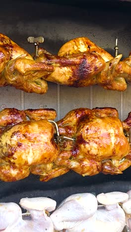 Roasting chickens on a rotisserie in Thailand
