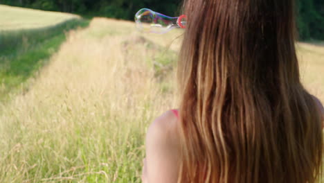 a-woman-blowing-soap-bubbles