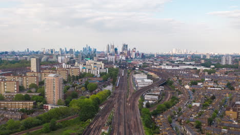 aerial hyperlapse over busy train tracks london city