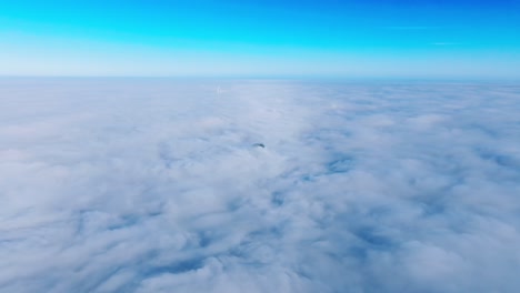 early morning aerial view above dense fog as riga skyscraper emerges from mist