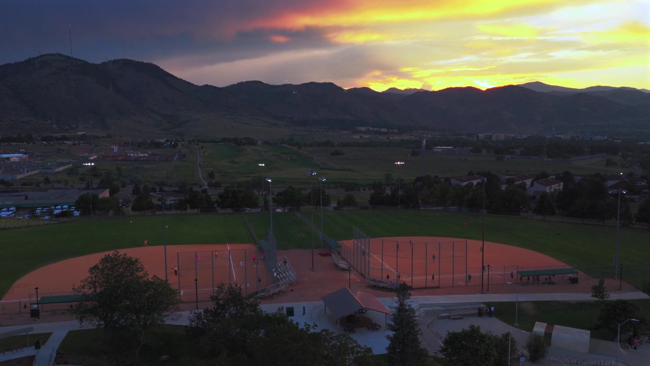 Ulysses Sports Complex Field under lights Skatepark summer sunset City of Golden aerial drone Colorado Rocky Mountains Front Range foothills Clear Creek Canyon South Table Mountain pan left motion