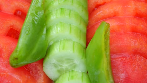 sliced cucumber, tomatoes, and bell peppers