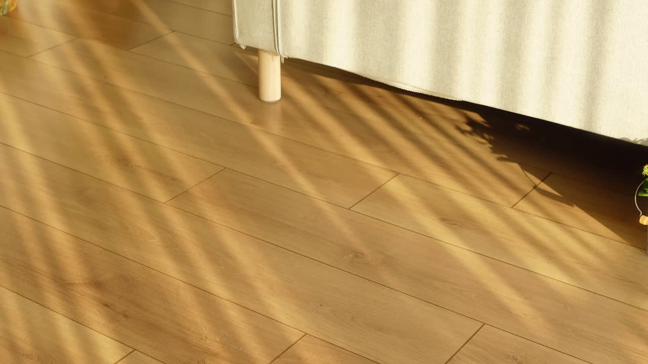 A wooden floor with light and shadow