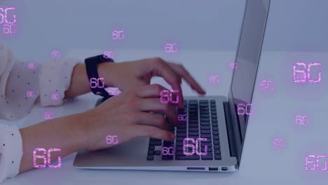 Typing on laptop, hands displaying 6G technology animation in school setting