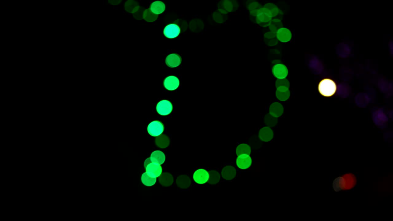 Bokeh sfocato verde arancione in movimento
