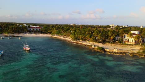 Drone-shot-of-the-coastline-beach-with-clearwater-in-a-peaceful-sunny