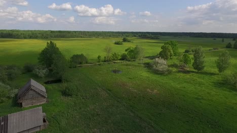 country side panoramic landscape in summer time from above and ground with hay rolls and roads