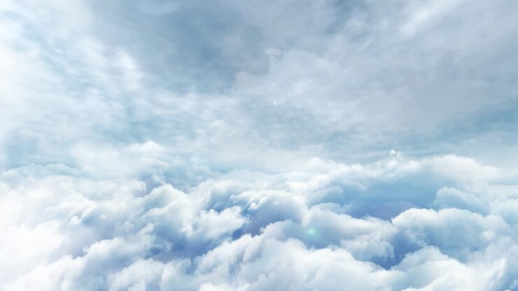 timelapse of thick white clouds in a clear blue sky