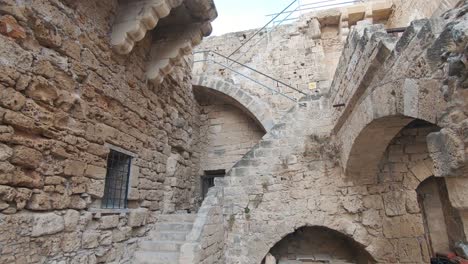 old stone staircase leading to the upper part of kyrenia castle walls and ramparts in cyprus - wide slide shot