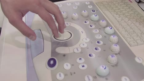 person operating an ultrasound machine