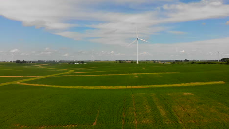 forward moving aerial 4k footage of wind turbine for green renewable energy