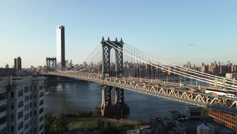 flying through building revealing the brooklyn bridge during golden hour shot in 4k 24p