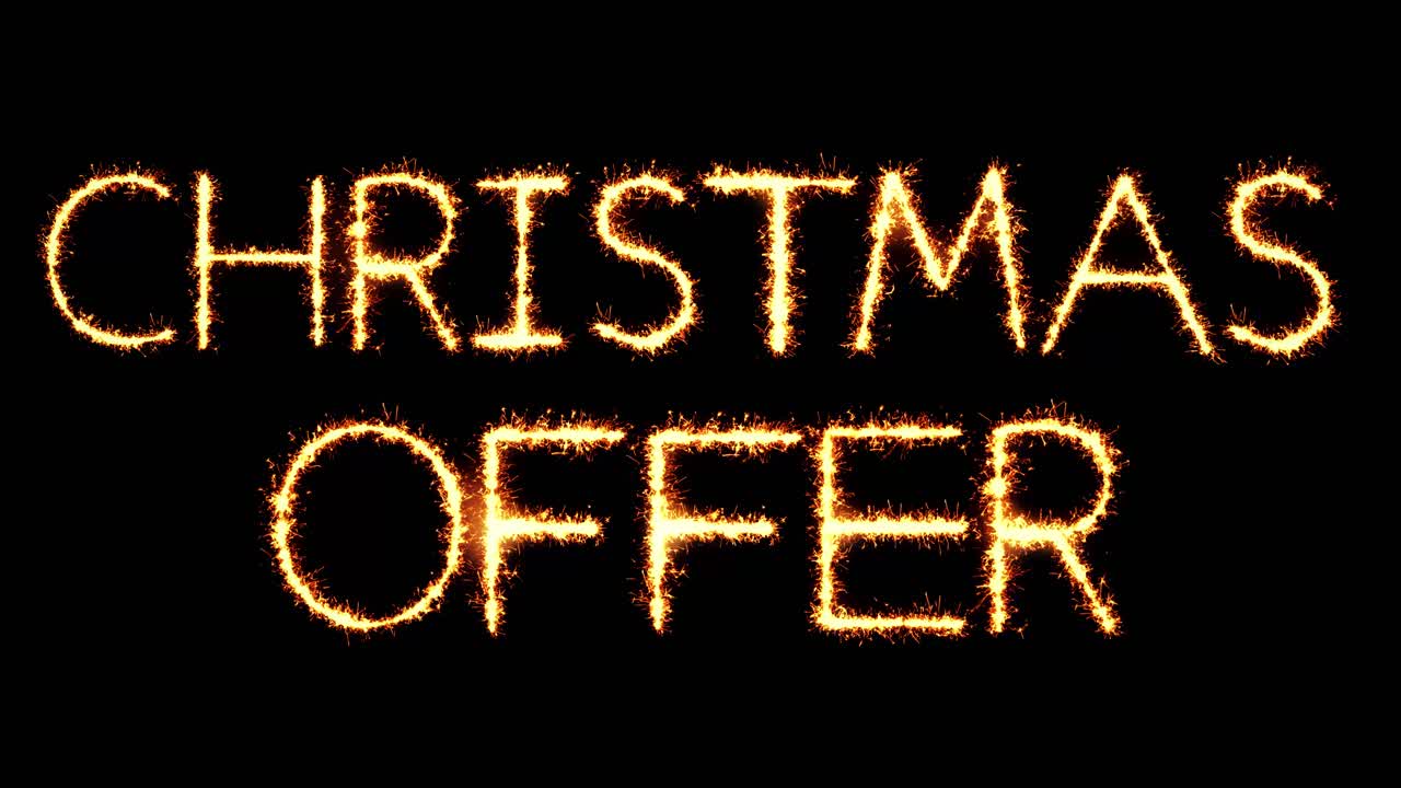 Christmas offer text sparkler writing with glitter sparks particles firework on black 4k loop