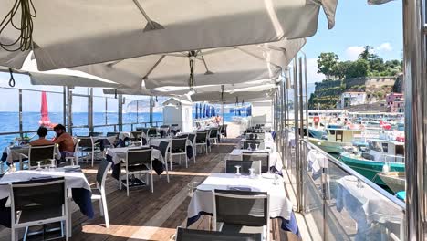 dining area with sea view and boats