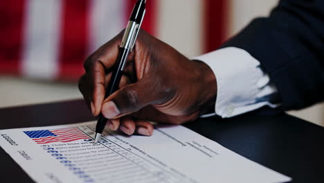 hand marking a ballot during an election