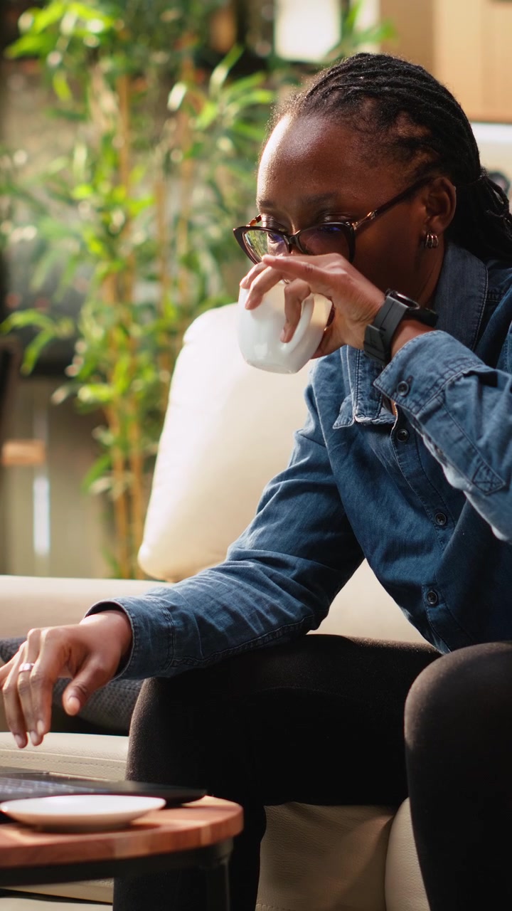 Vertical Video Stressed woman checking hour on wristwatch for time management