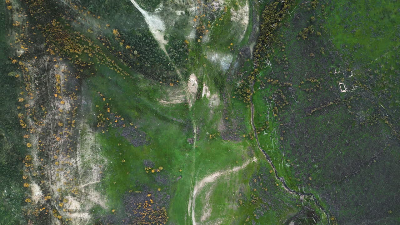 Foothills next to the Zahara de la Sierra in Spain. Aerial Drone green landscape.