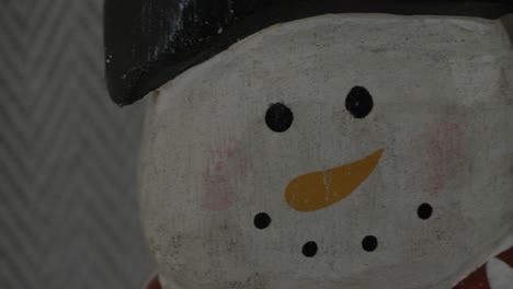 slow up pan of a wooden snowman decoration for christmas