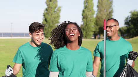 happy young volunteers in park