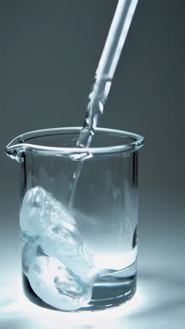 liquid pouring into beaker