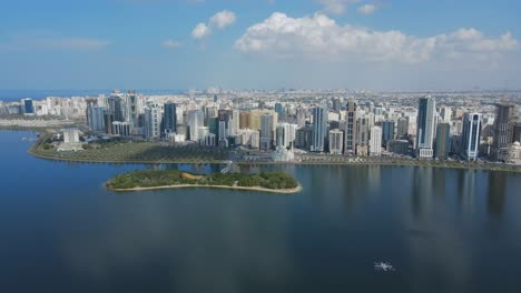 4k: sharjah from the top, aerial view of sharjah city and khalid lake, al noor mosque and island, travel tourism business in the united arab emirates