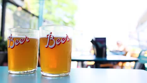 two pints of beer on a table