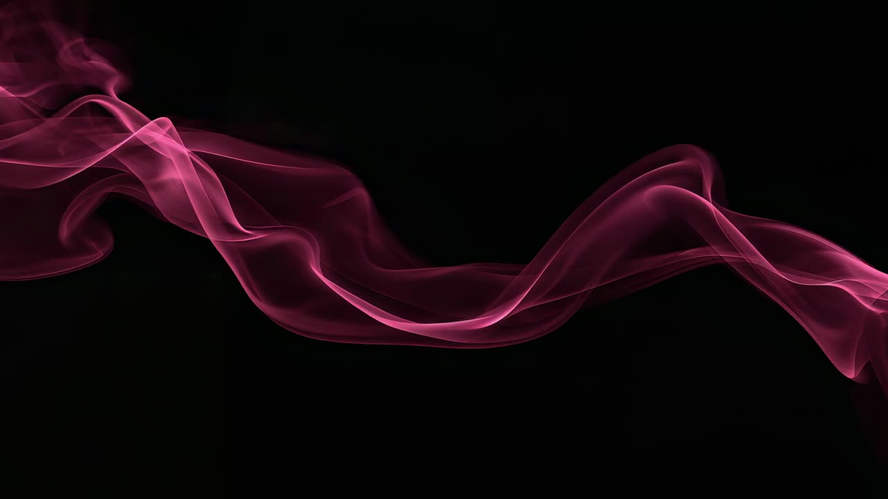 Flowing pink smoke ribbon forming waves, knots from breeze on black set, lit by directional light