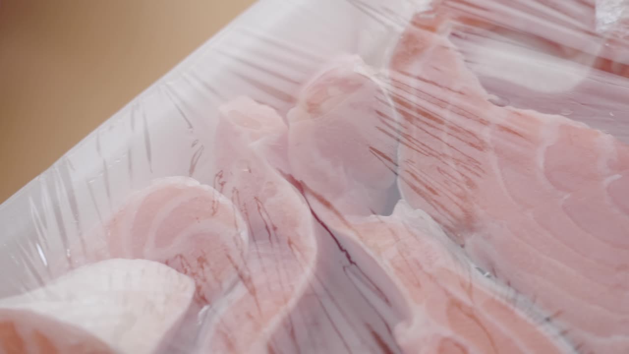 Raw Salmon Fillets in Plastic Packaging