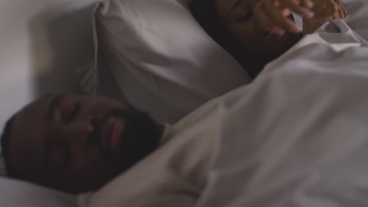 Close Up Of Loving Couple Lying Asleep In Bed At Home At Night 2