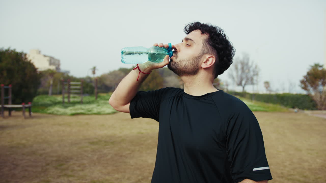 Athlete Refreshes With Water After A Hard Workout