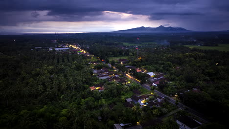 Hyperlapse-timelapse-of-cars-driving-along-road-in-countryside-at-dusk,-Indonesia