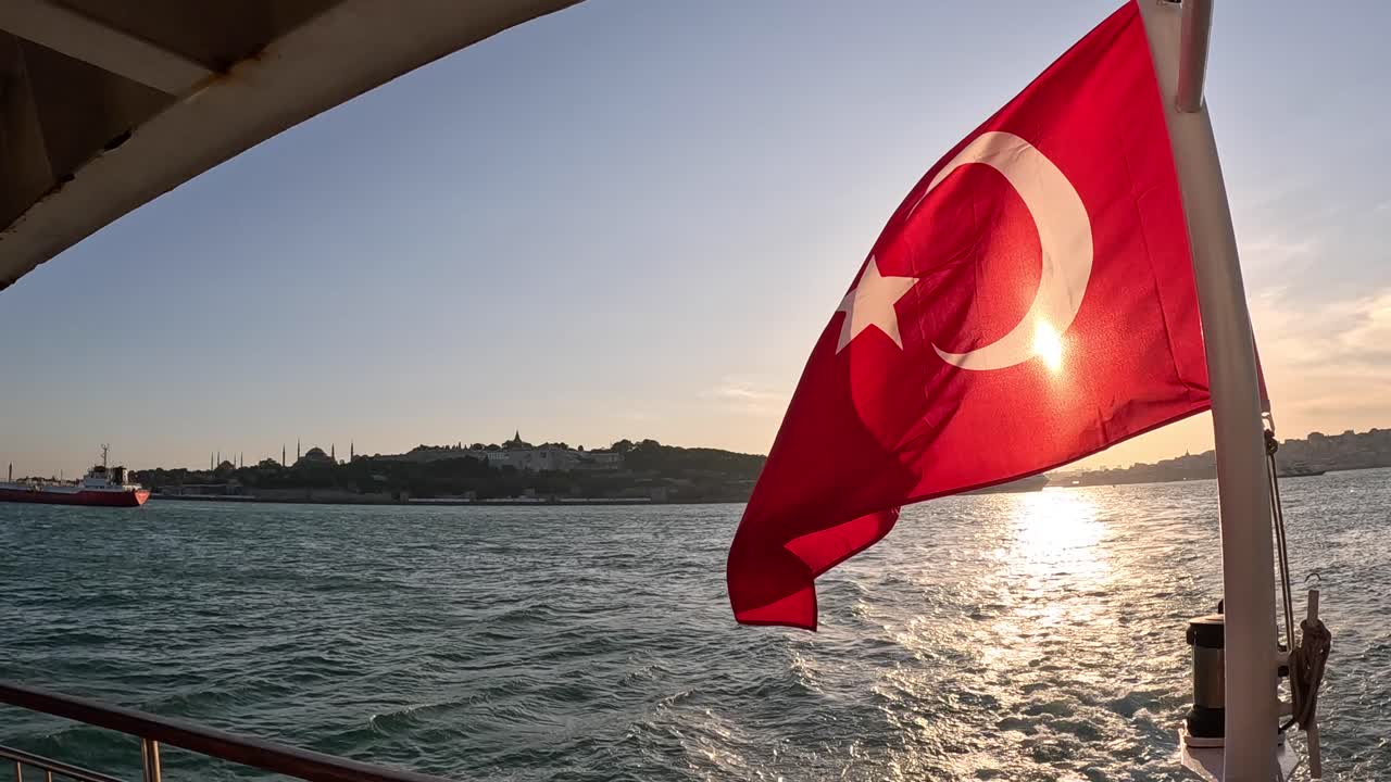 TURKISH FLAG WAVING IN THE BOSPHORUS ISTANBUL | TURKISH FLAG AT SUNSET | HISTORICAL PENINSULA SILHOUETTE