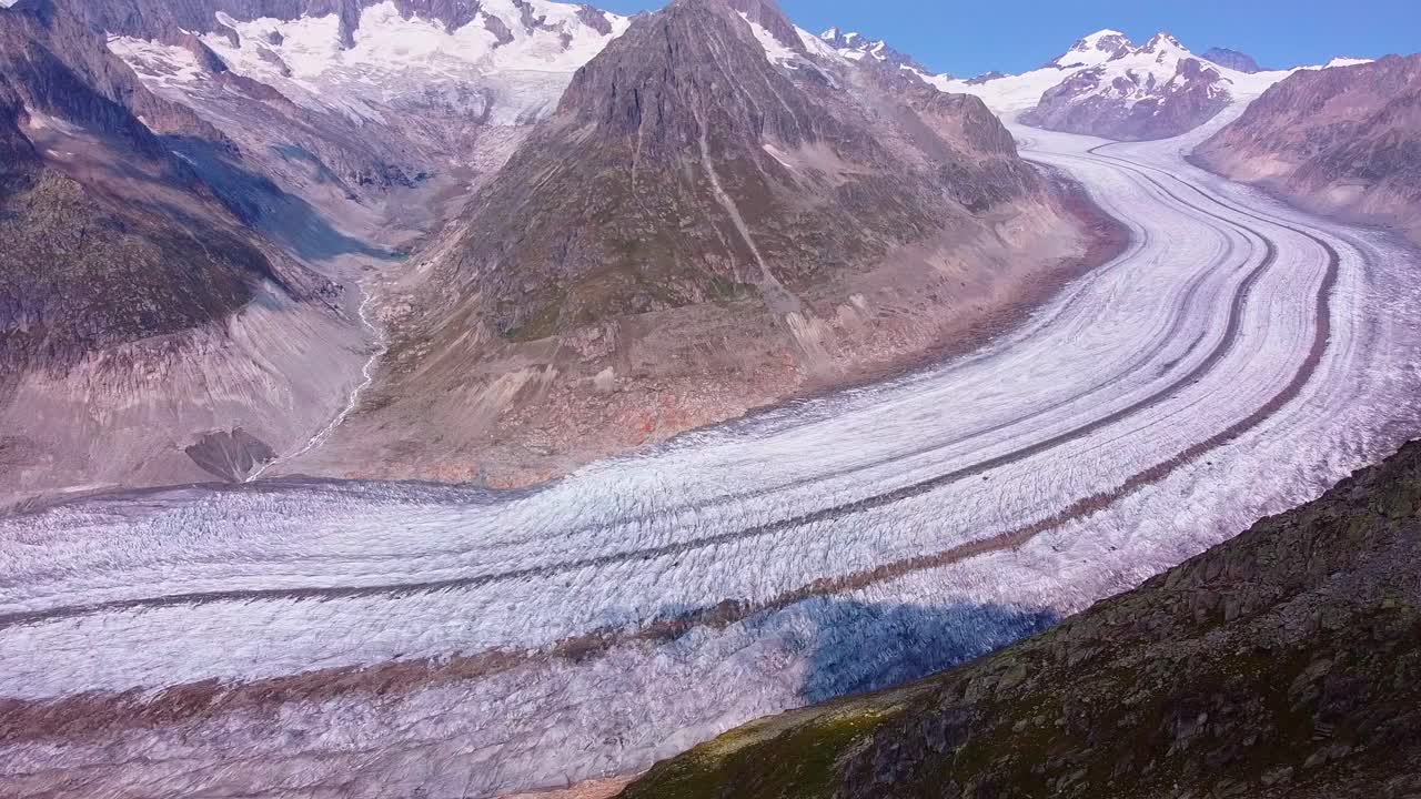 Scenic aerial view of the Aletsch Glacier in the Swiss Alps during summertime, Mountain landscape Switzerland