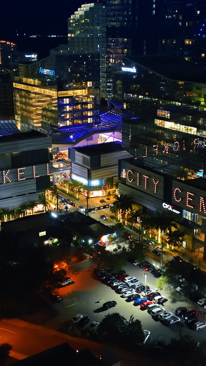 Vibrant downtown of Miami, Florida, USA at night. Lively view of the city from top. Vertical video