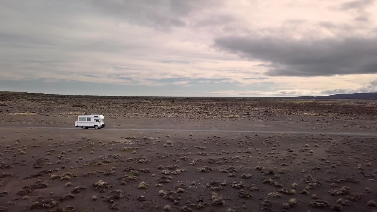 Camper Van Journey Through a Volcanic Desert Landscape