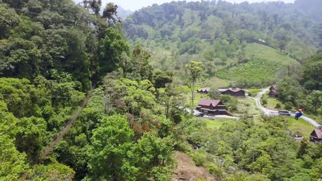 Person-Riding-Zipline-in-Jungle-Tree-Environment-in-Panama,-Aerial