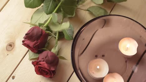 Floating-tea-light-candles-with-red-rose-for-romantic-evening