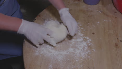 baker hands kneading dough in table flour preparation for making traditional georgian dumpling